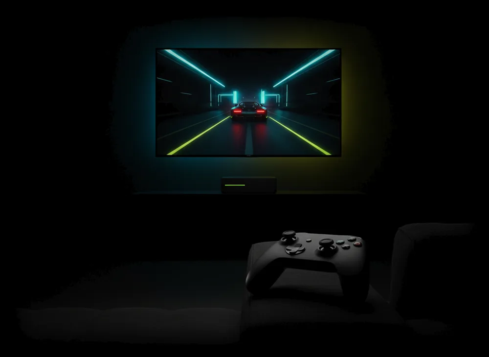 A living-room TV streaming a PC game, a controller on the sofa